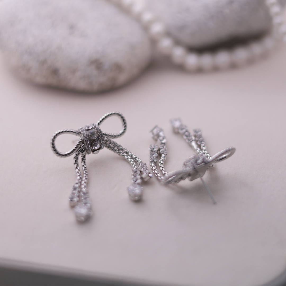 The Diamanté Bow Tassel Earrings