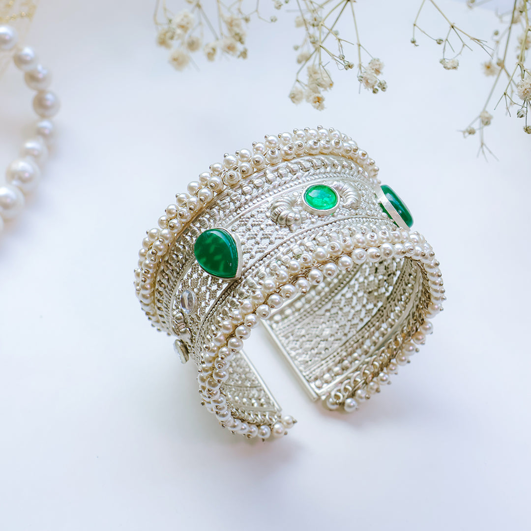 Oxidized Silver Hand Cuff with Green Kundan Stones and Pearl Embellishments