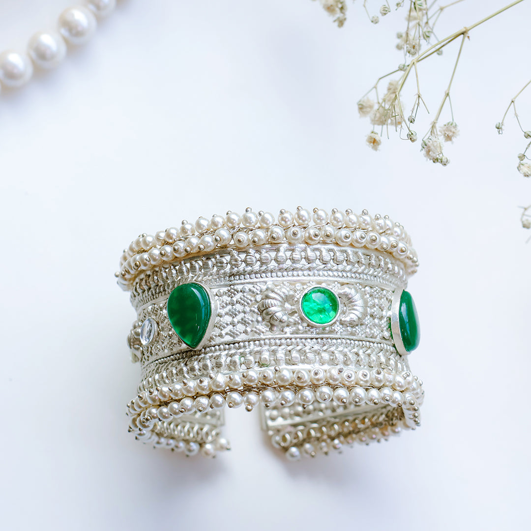 Oxidized Silver Hand Cuff with Green Kundan Stones and Pearl Embellishments