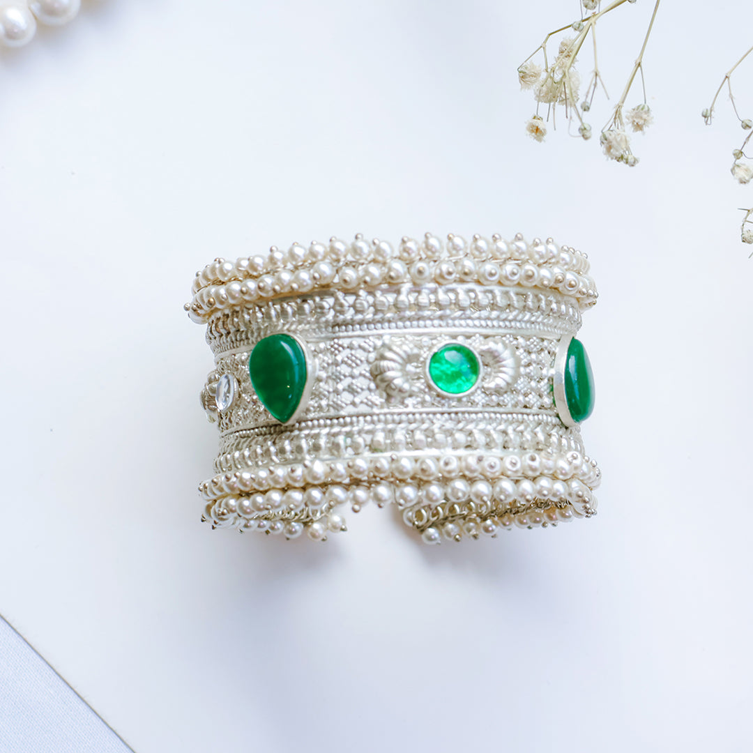 Oxidized Silver Hand Cuff with Green Kundan Stones and Pearl Embellishments