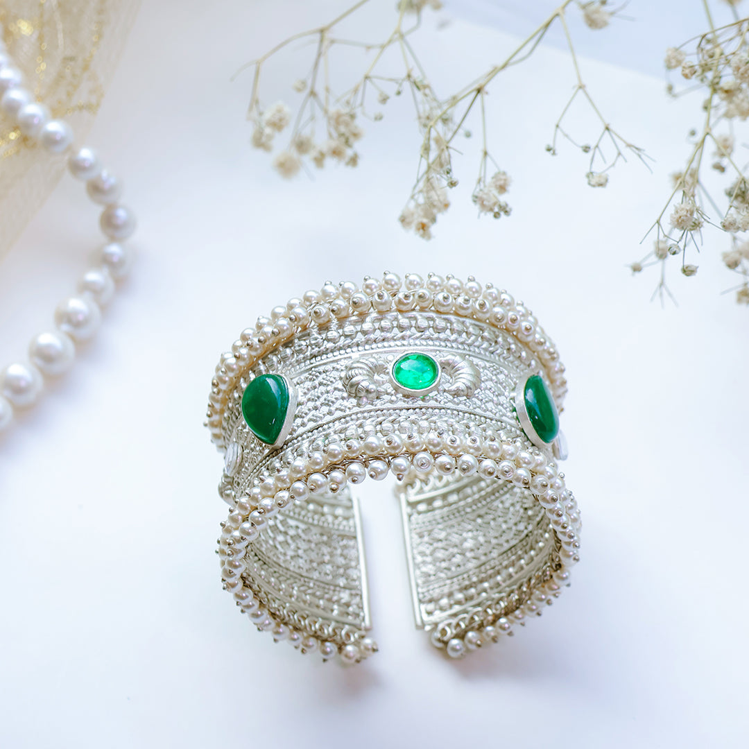 Oxidized Silver Hand Cuff with Green Kundan Stones and Pearl Embellishments