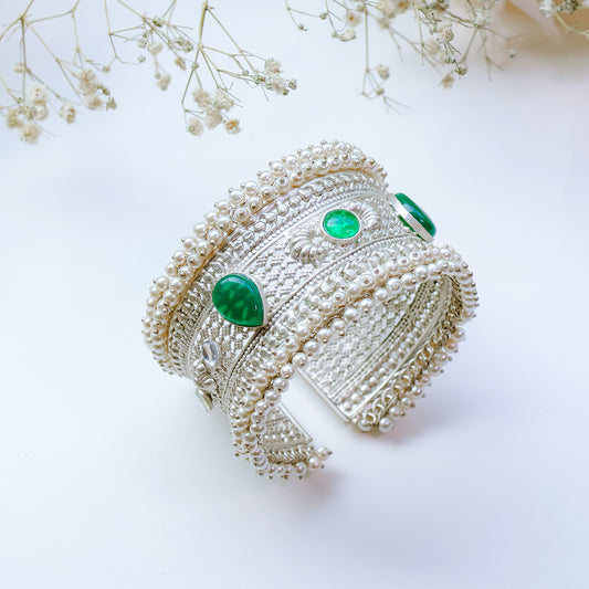 Oxidized Silver Hand Cuff with Green Kundan Stones and Pearl Embellishments