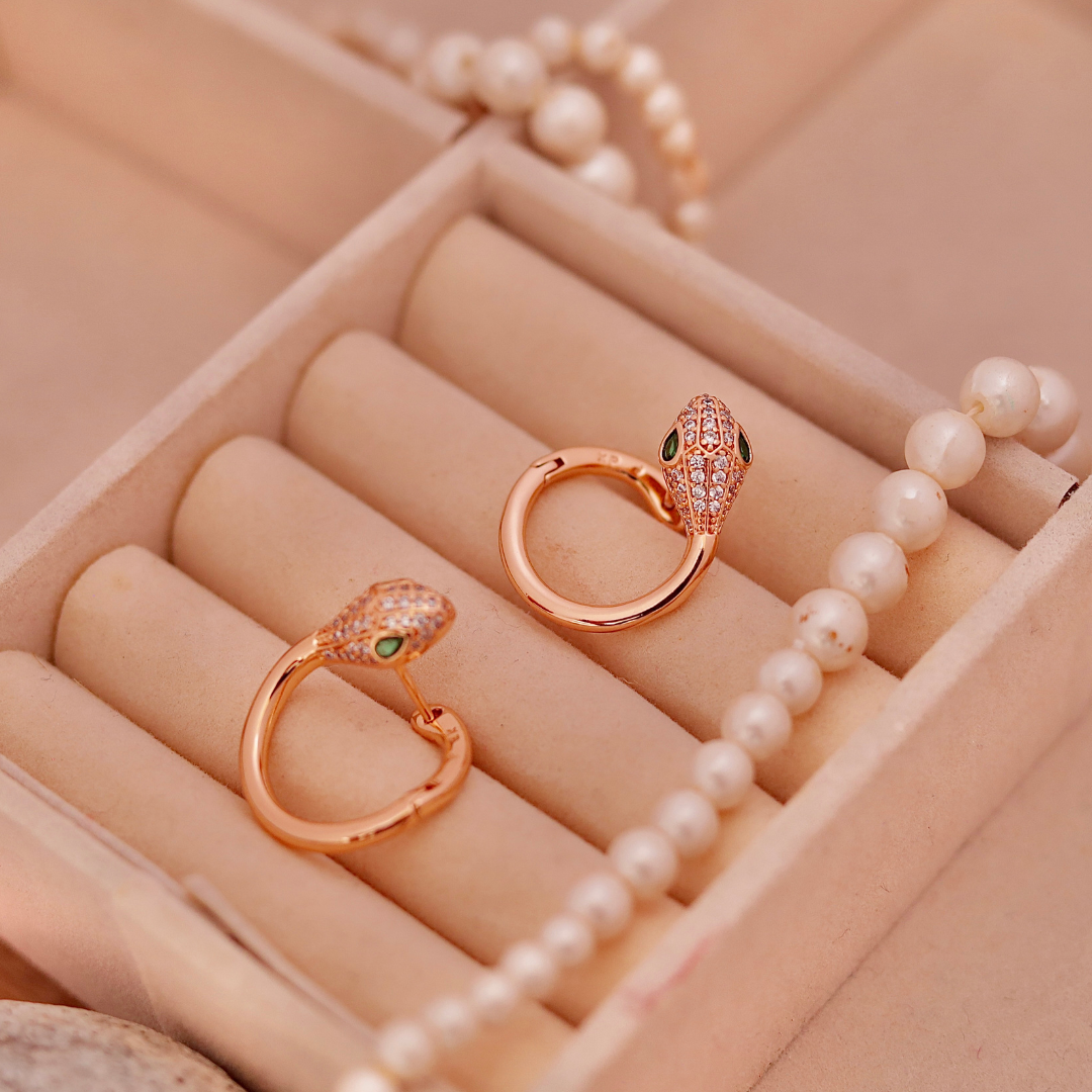 Rose Gold Snake Huggie Hoops with Green Crystal Eyes