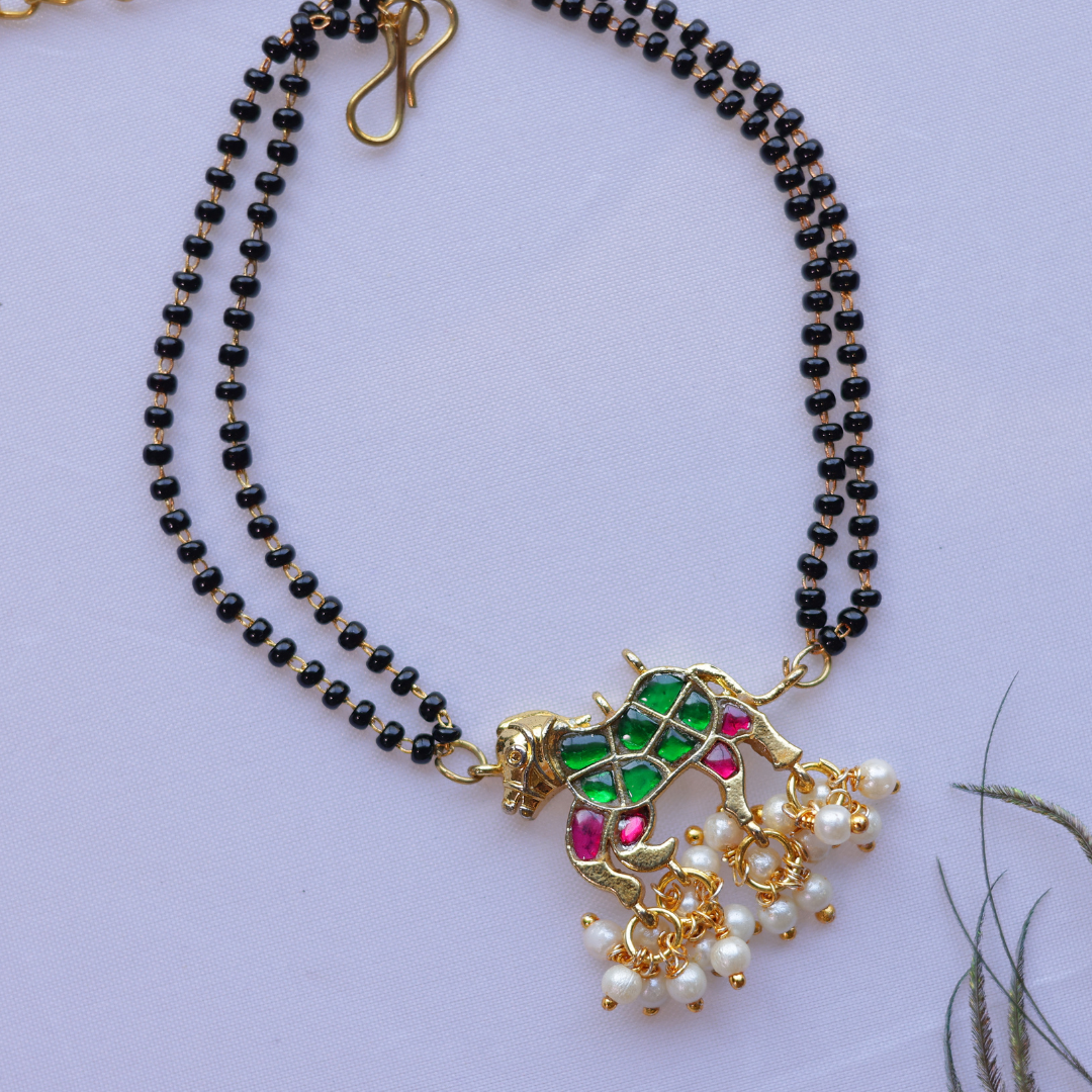 Handcrafted Double Layer Black Bead Hand Mangalsutra In Paachi Kundan Horse Charm