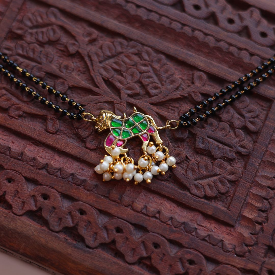 Handcrafted Double Layer Black Bead Hand Mangalsutra In Paachi Kundan Horse Charm