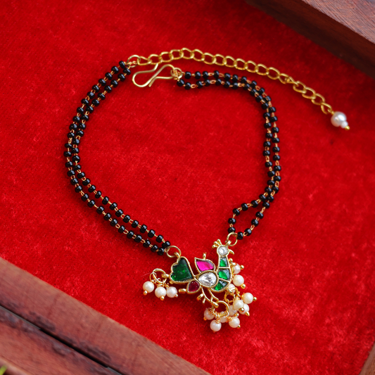 Handcrafted Double Layer Black Bead Hand Mangalsutra In Paachi Kundan Hen Charm