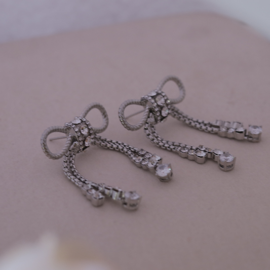 The Diamanté Bow Tassel Earrings