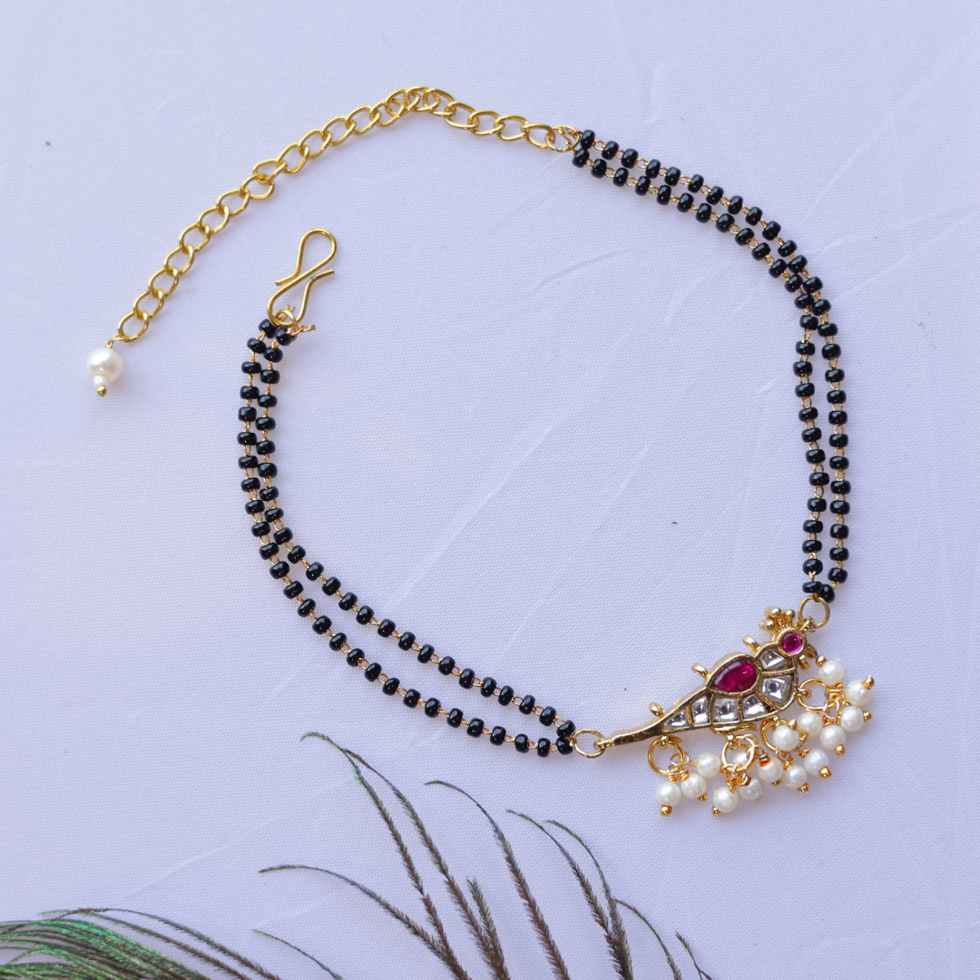 Handcrafted Double Layer Black Bead Hand Mangalsutra In Paachi Kundan Bird Charm