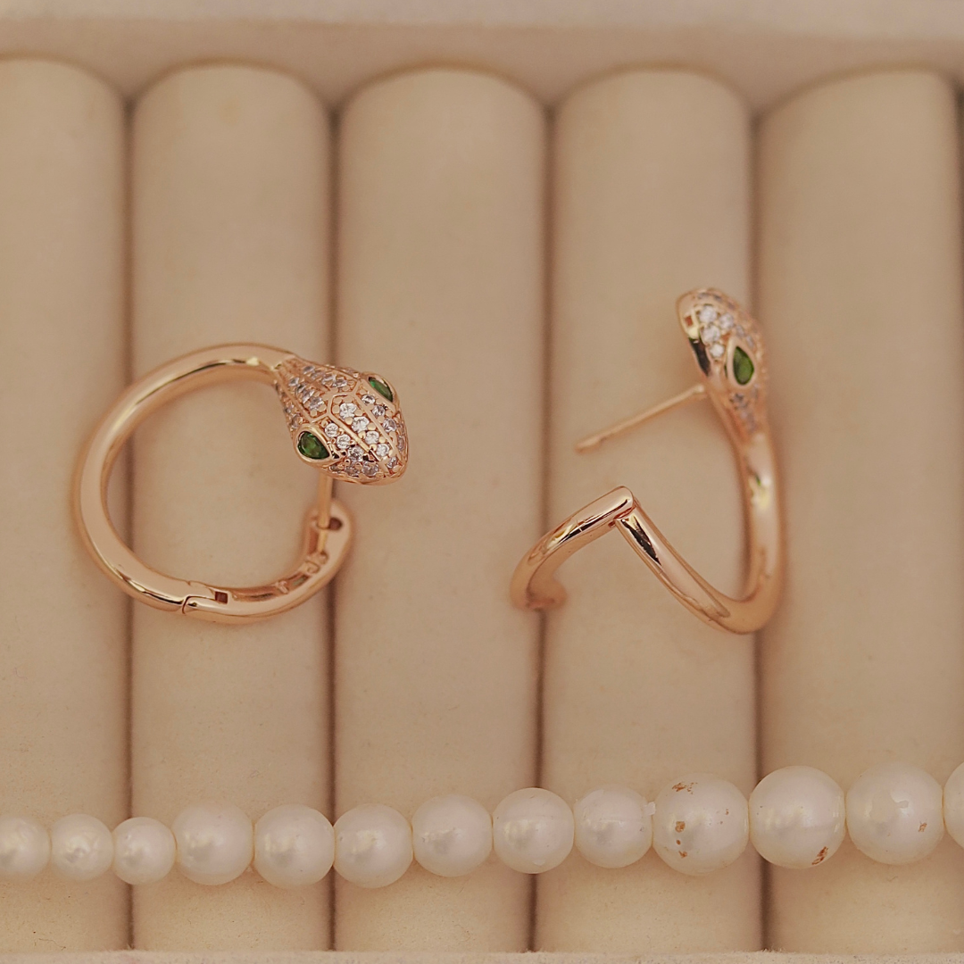 Rose Gold Snake Huggie Hoops with Green Crystal Eyes