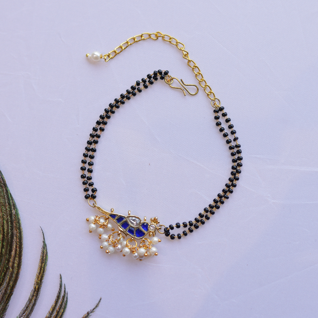 Handcrafted Double Layer Black Bead Hand Mangalsutra In Paachi Kundan Bird Charm