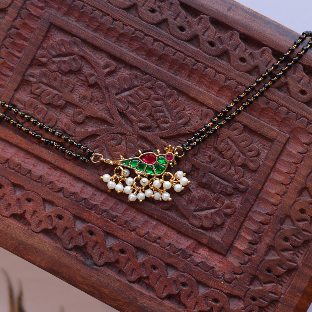 Handcrafted Double Layer Black Bead Hand Mangalsutra In Paachi Kundan Bird Charm