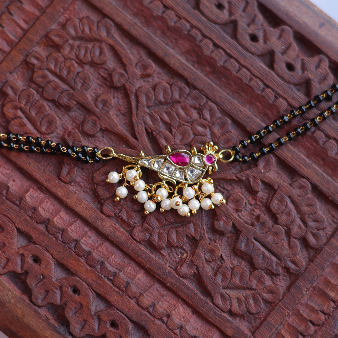 Handcrafted Double Layer Black Bead Hand Mangalsutra In Paachi Kundan Bird Charm