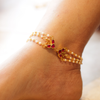 Traditional Gold-Plated Multi-Strand Pearl Anklets with Emerald Green and Ruby Red Stone Accents