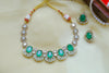 Jewelry set with necklace and earrings on a beige background