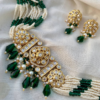 Kundan Choker Set Adorned With Pearls And Green Beads