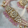 Kundan Choker Set Adorned With Pearls And Pastel Pink Beads